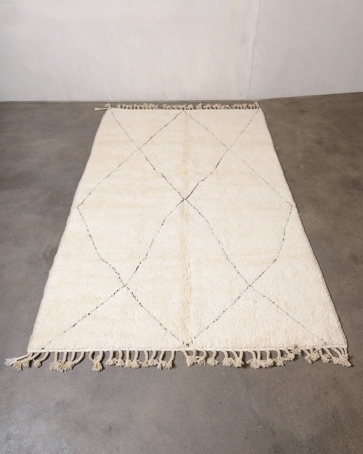 Modern, designer, handcrafted Berber rug from Morocco. Beniourain carpet with minimalist design, natural wool pile and a fluffy texture.